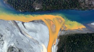 A milky orange river viewed from directly above